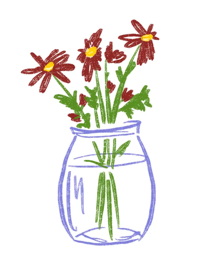 Red flowers in a clear glass vase